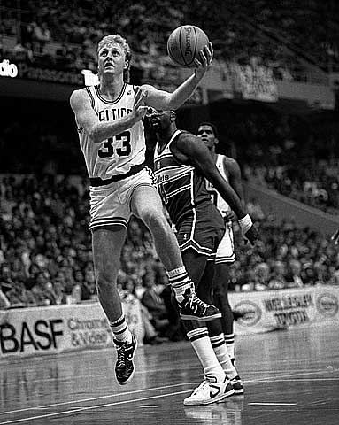 Larry Bird going up for a layup in a Boston uniform