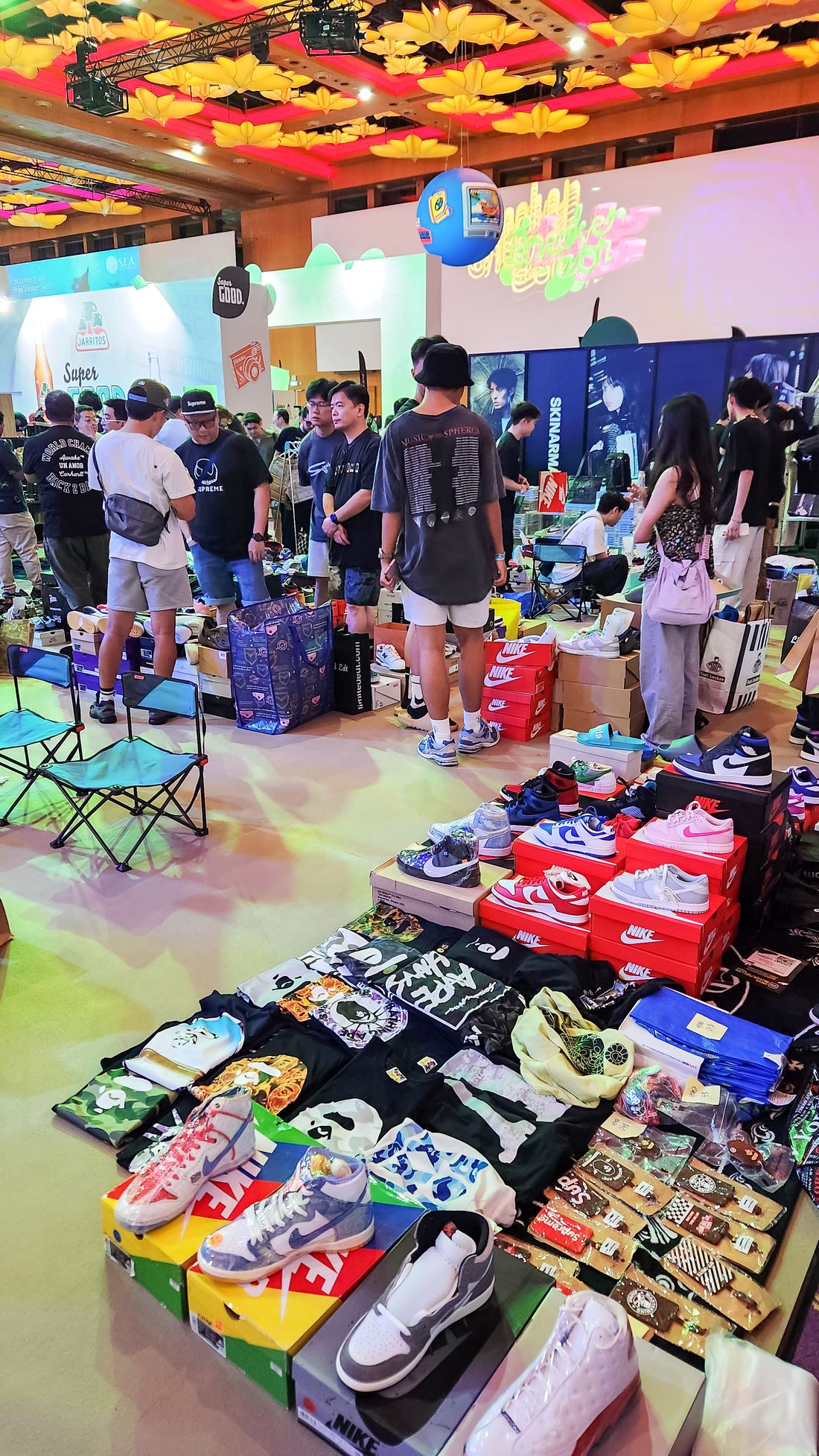 Crowd trading sneakers at a sneaker convention trading pit in Singapore